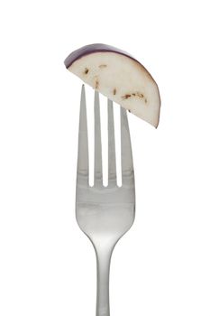 Close-up image of a fork with slice eggplant isolated on a white surface