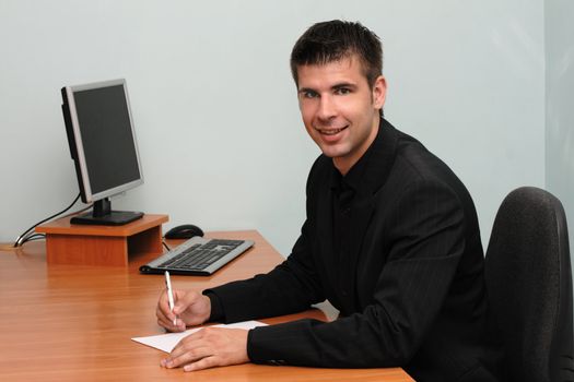 Young successful man in an office