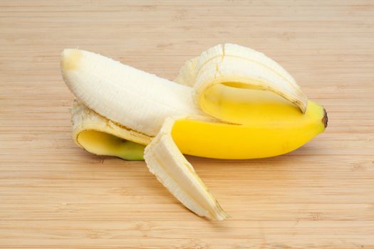 Peeled banana on a desk
