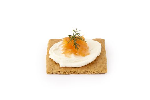 Graham cracker with sour cream and smoked salmon on top