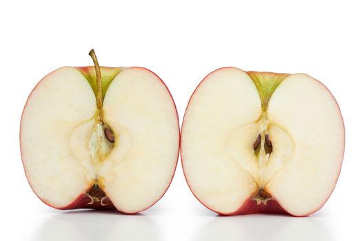 Angled halved apple on a white background