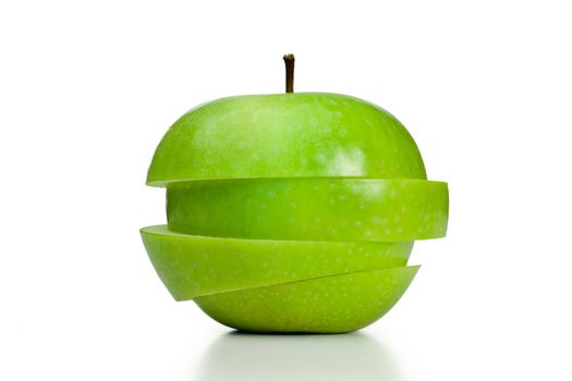Apple cut into slices on a white background