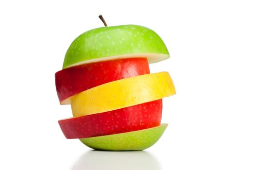 Combination of green, yellow and red apples on a white background