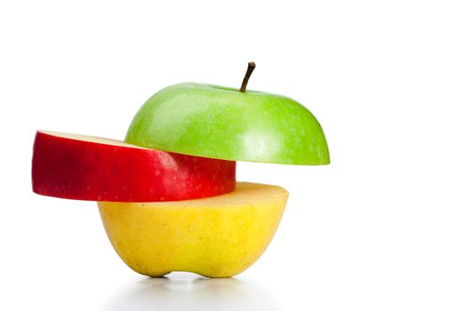 Combination of green, yellow and red apples on a white background