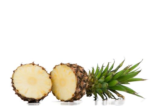 Halved pineapple on a white background