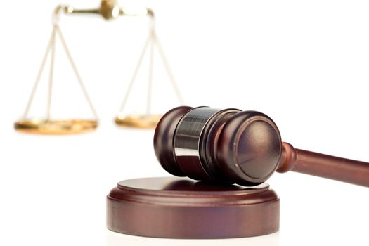 Gavel and scale of justice on a white background
