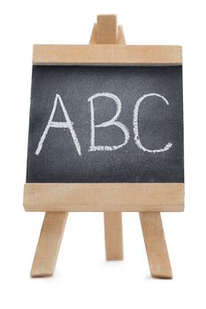 Chalkboard with the leters ABC written on it isolated against a white background