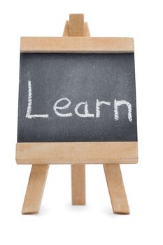 Chalkboard with the word learn written on it isolated against a white background