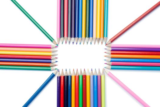Top view of color pencils shape on a white background