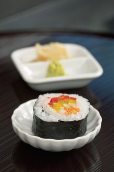 Japanese cuisine with sushi, raw salmon and wasabi