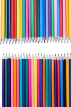 Color pencils confrontation on a white background