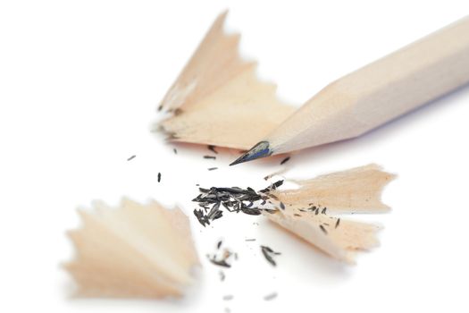 White pencil and its peelings on a white background