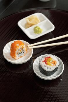 Close-up image of a Japanese food on the saucer on the wooden table