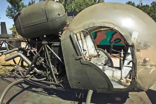 Detail of a old green military helicopter