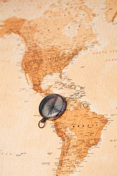World map with compass showing South America