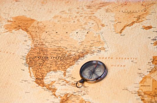 World map with compass showing North America
