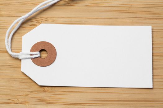 White and brown tag isolated on a desk