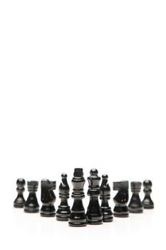 Black pieces of chess on a white background