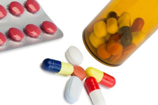 Pills with box pills and serynge on a white background