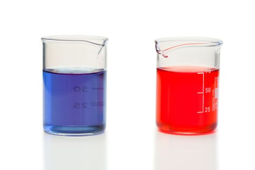 Red and blue liquid in beakers on a white background