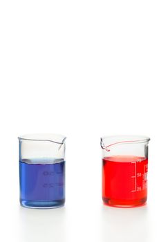 Blue and red liquid in beakers on a white background