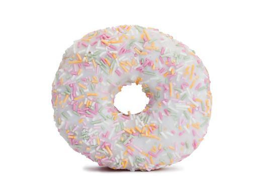 Pink Iced Doughnut covered in sprinkles isolated against white background
