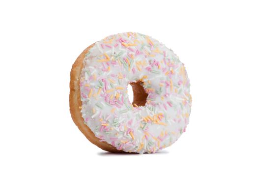 Pink Iced Doughnut covered in sprinkles isolated against white background