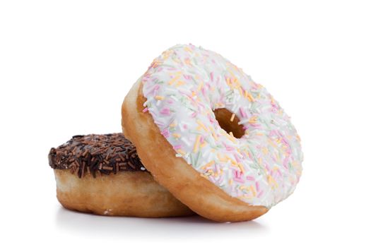 Pink iced and chocolate donuts on a white background 