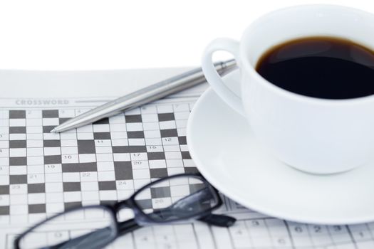 Newspapers and crossword puzzle on a white background