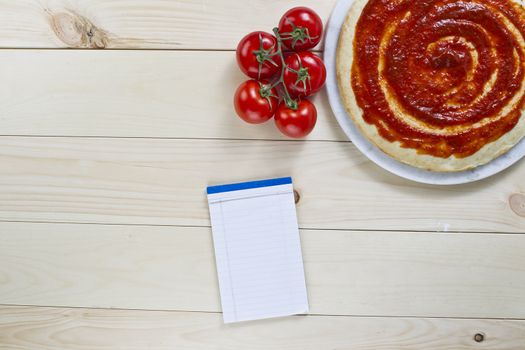 Pizza crust with tomato sauce