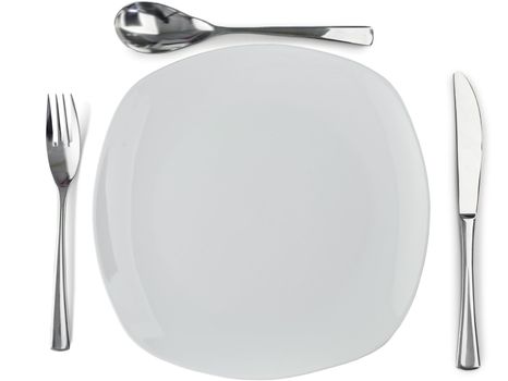Cultery around plate on a white background