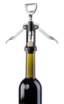 Bottle of wine with a corkscrew, isolated on white background