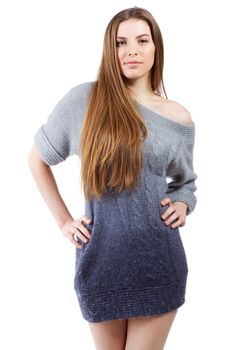 Beautiful elegant model in woollen sweater against white background