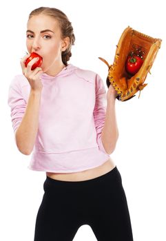 Young woman holding a tomato in baseball glove