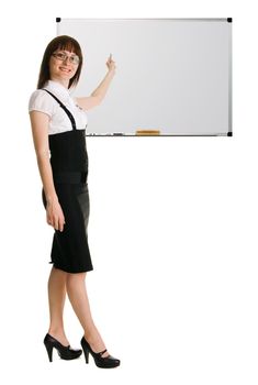 Young woman in businesssuit pointing on whiteboard