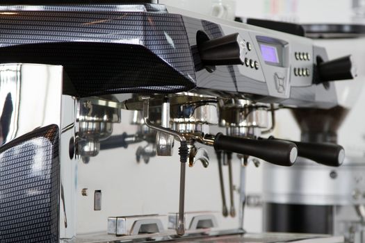 Professional coffee machine closeup with selective focus