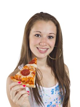 Portrait of smiling teenage girl holding a slice of pizza over white background.