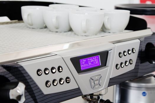 Professional coffee machine closeup with selective focus