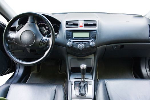 Modern car dashboard and front seats view