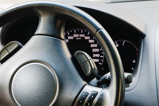 Illuminated dashboard and steering wheel of a modern car