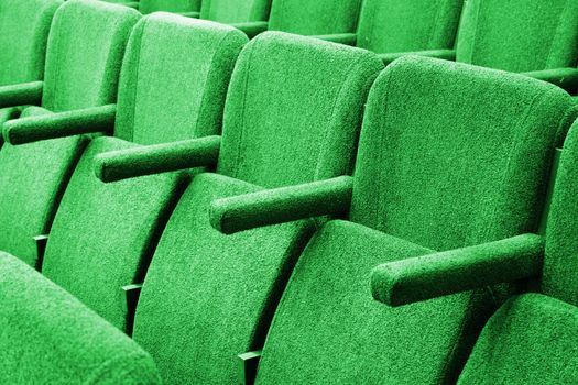 Closeup picture of chairs in empty cinema auditorium 