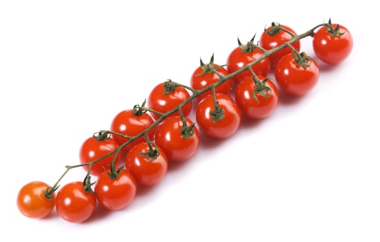 Branch of small tomatos, isolated on white