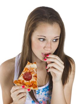 Thoughtful teenage girl eating pizza over white background.
