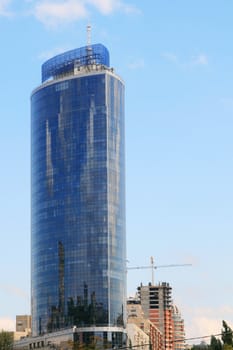 Tall blue office building in a city center