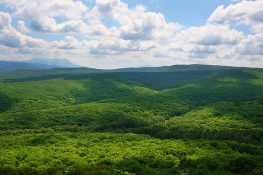 Mountain valley and cloudy sky