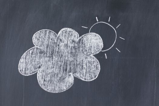 Cloud covering the sun on a blackboard