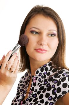 Beautiful young woman applying makeup, closeup photo