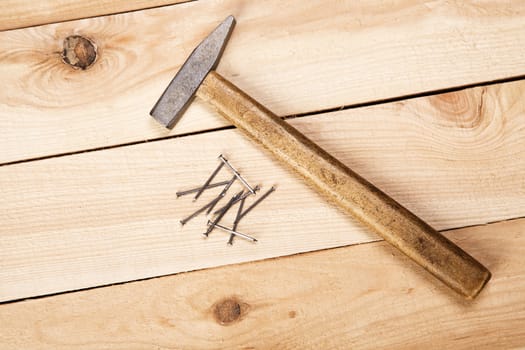 Carpenter's tools on pine desks, closeup photo