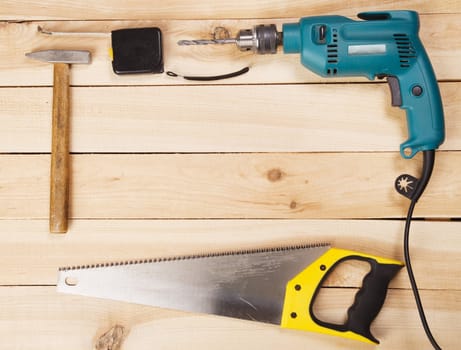 Carpenter's tools on pine desks, closeup photo