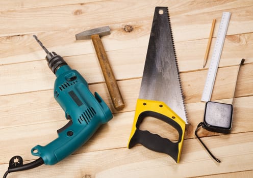 Carpenter's tools on pine desks, closeup photo